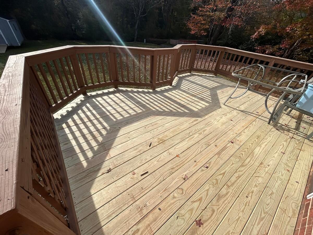 Deck after renovation with new wood boards installed