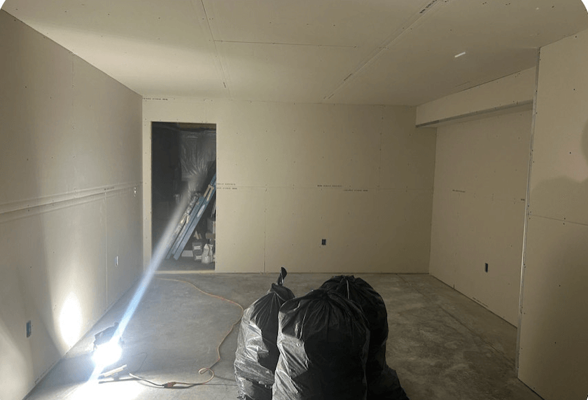 Basement after drywall installation with smooth walls